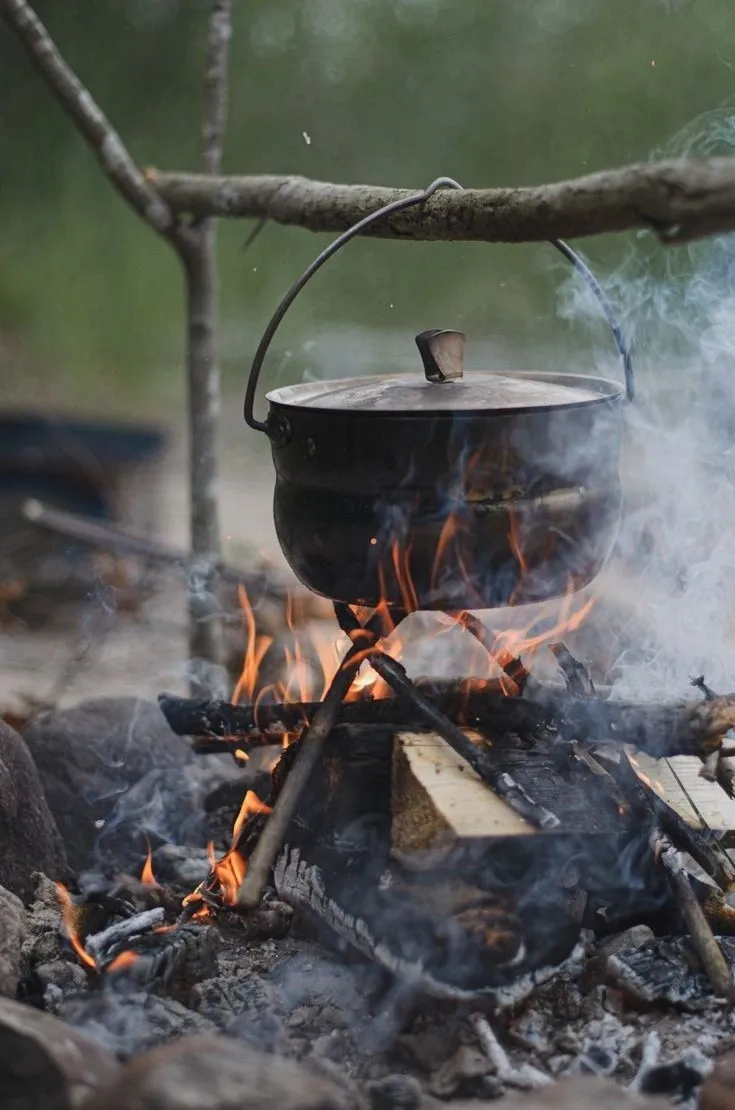 Camp stove and instant meals being prepared outdoors