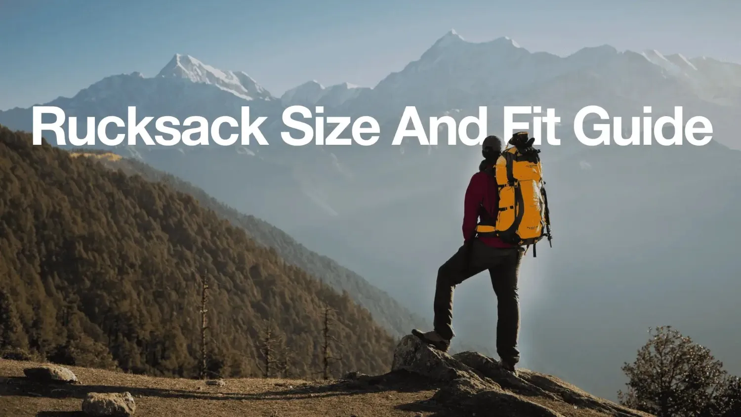 Hiker overlooking snow-capped mountains, banner for the Rucksack Size and Fit Guide